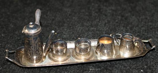 An eight piece miniature silver tea/coffee set